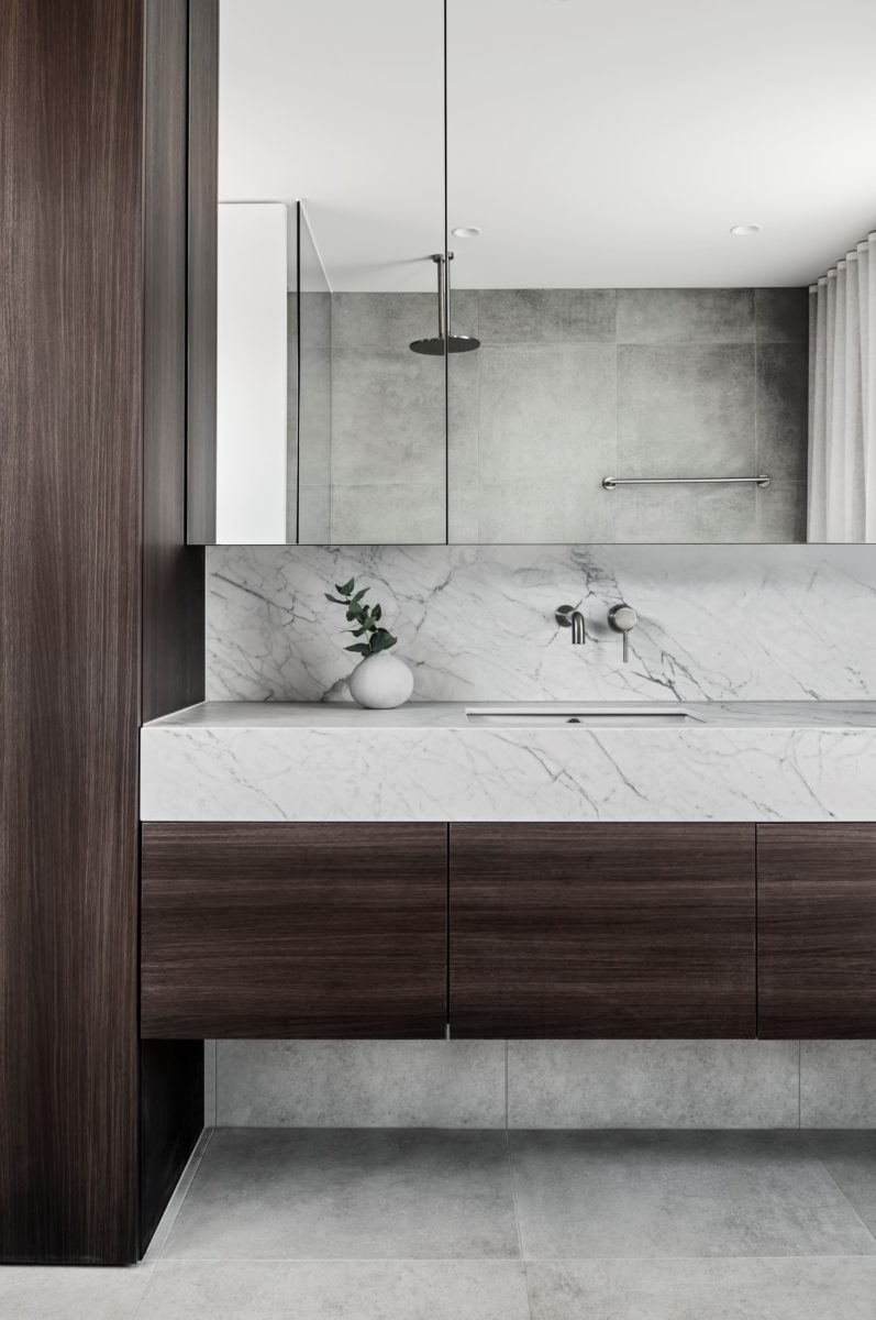 Bathroom vanity with marble look porcelain top by Laminam
